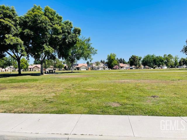 surrounding community with a lawn