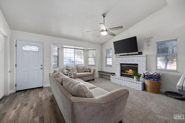 6305 Wolfe Creek Dr, Bakersfield, CA 93306 - living room featuring a ceiling fan, a brick fireplace, vaulted ceiling, and wood finished floors