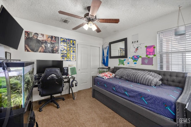 6305 Wolfe Creek Dr, Bakersfield, CA 93306 - bedroom with carpet floors, a textured ceiling, a closet, a ceiling fan, and an office area