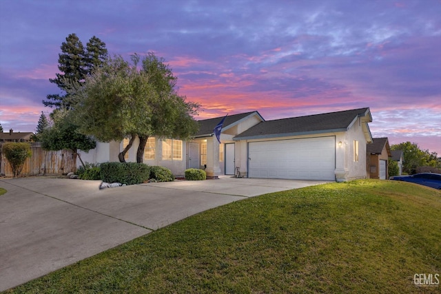 6305 Wolfe Creek Dr, Bakersfield, CA 93306 - ranch-style house with stucco siding, a garage, and driveway