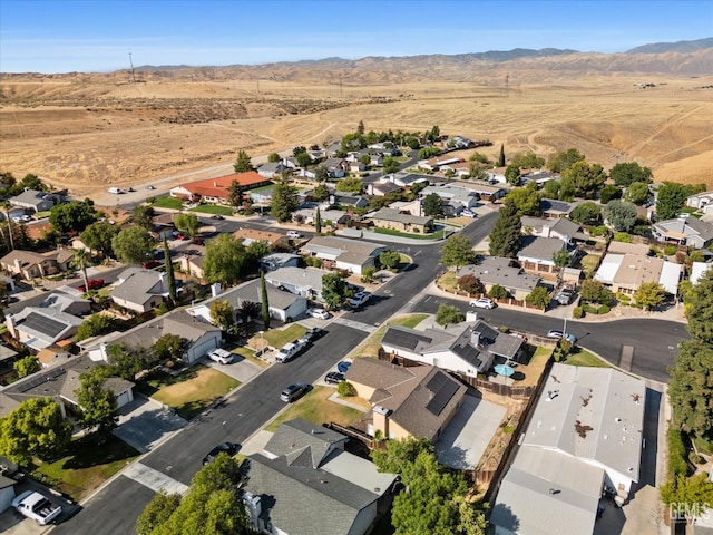 6305 Wolfe Creek Dr, Bakersfield, CA 93306 - aerial view of property's location with a mountain backdrop and nearby suburban area