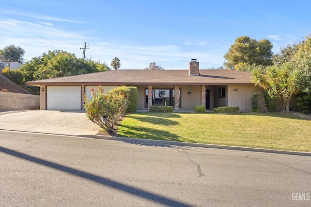 ranch-style house with a garage, concrete driveway, a front lawn, and a chimney