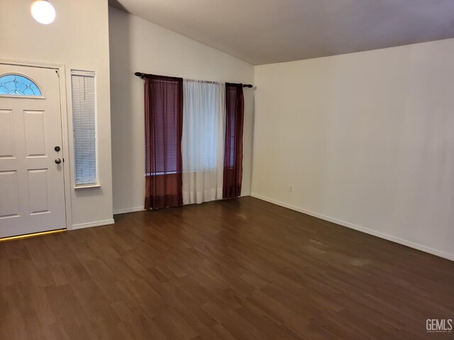 dining area featuring dark hardwood / wood-style floors and an inviting chandelier