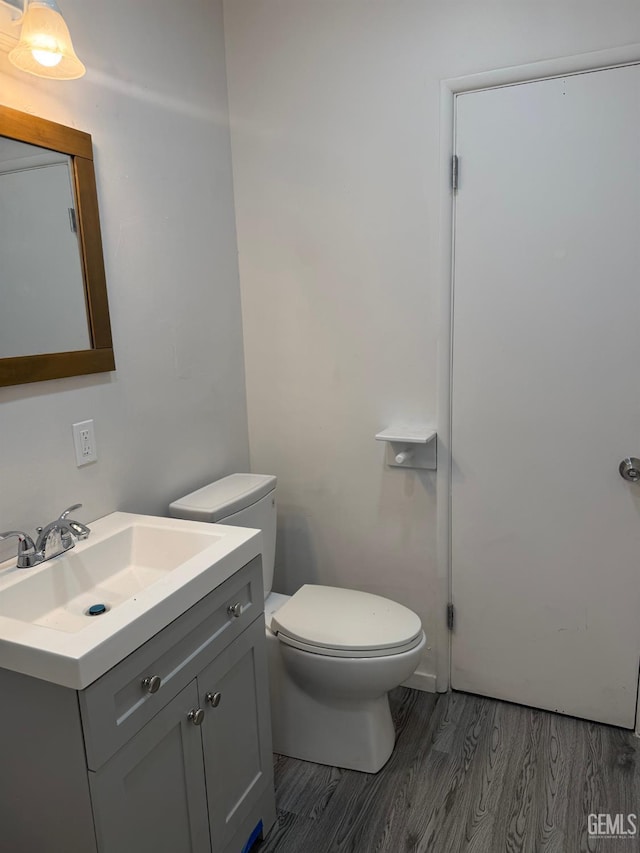 1708 Bower St, Bakersfield, CA 93305 - bathroom with wood finished floors and vanity