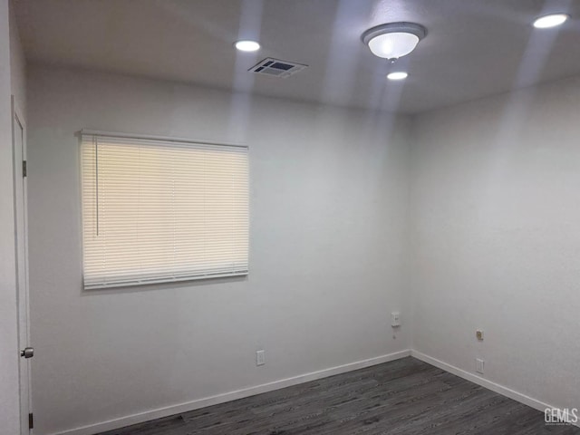 1708 Bower St, Bakersfield, CA 93305 - empty room featuring dark wood finished floors and recessed lighting