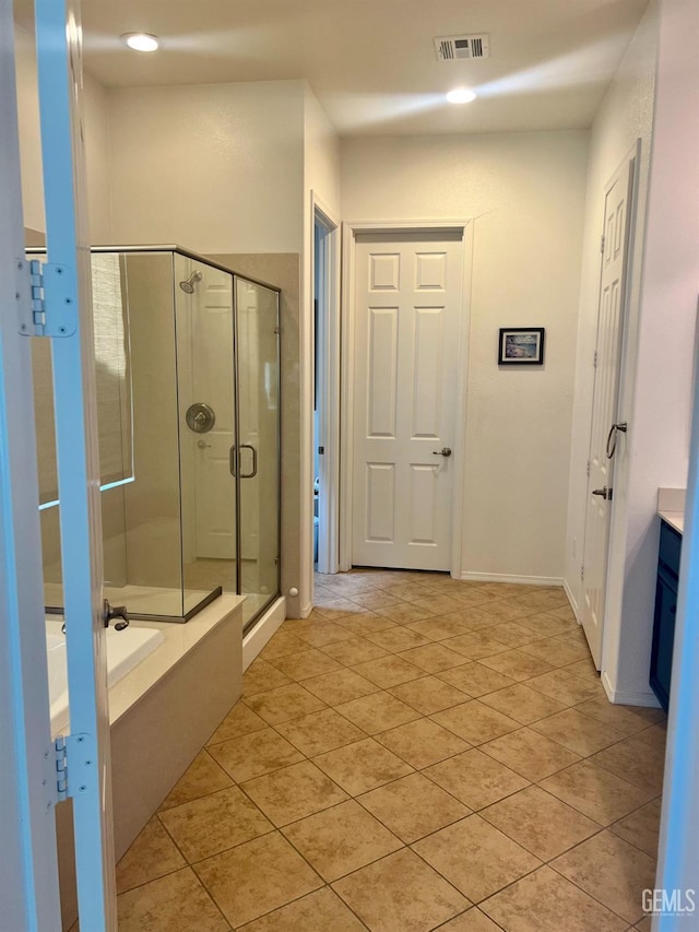 9909 Stockholm Pl, Bakersfield, CA 93306 - bathroom with vanity, tile patterned floors, and plus walk in shower