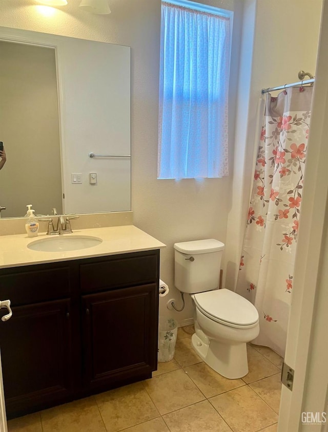 9909 Stockholm Pl, Bakersfield, CA 93306 - bathroom with vanity, toilet, curtained shower, and tile patterned flooring