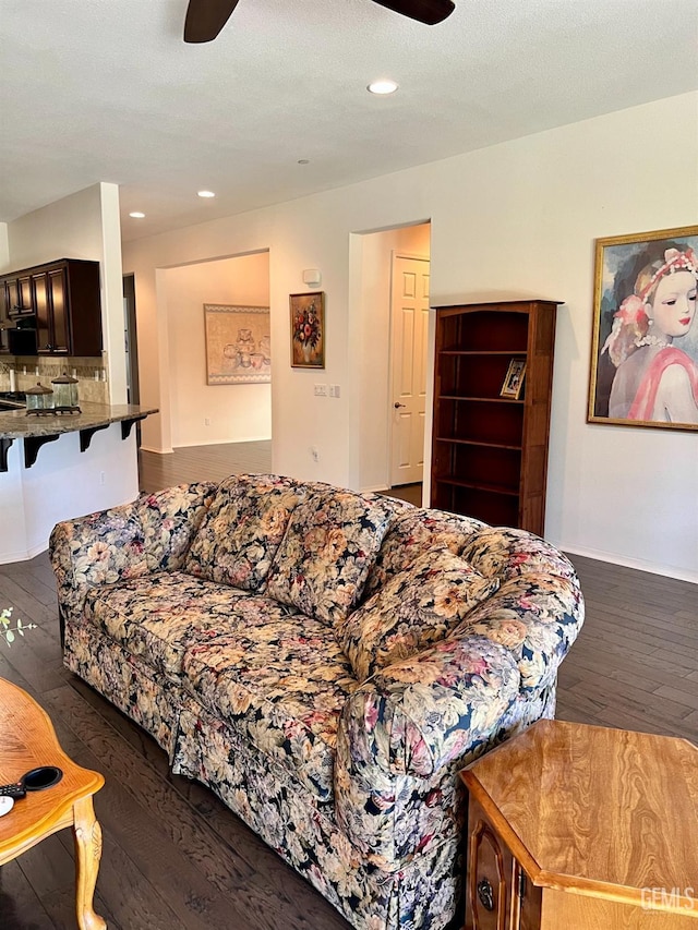 9909 Stockholm Pl, Bakersfield, CA 93306 - living room featuring dark wood-type flooring and ceiling fan