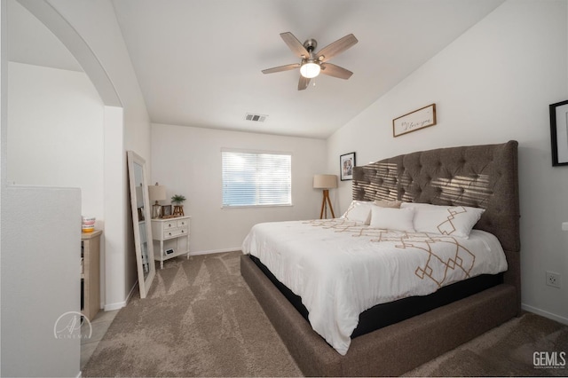 carpeted bedroom featuring ceiling fan and lofted ceiling