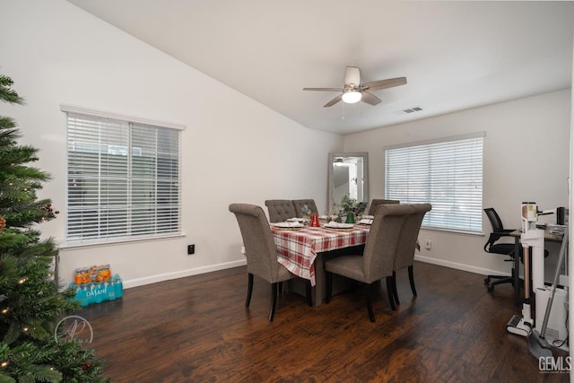 dining space with dark hardwood / wood-style floors, ceiling fan, and lofted ceiling