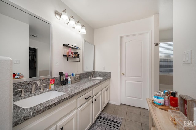 bathroom featuring tile patterned floors and vanity