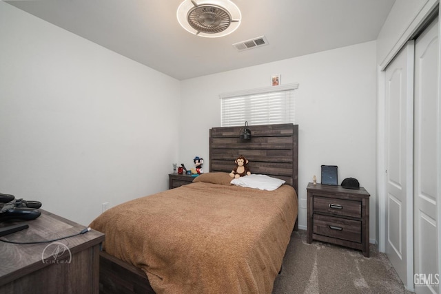 carpeted bedroom featuring a closet