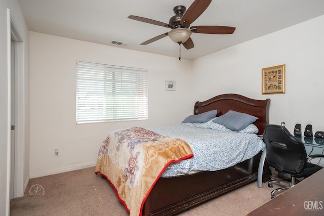 bedroom with ceiling fan and light colored carpet