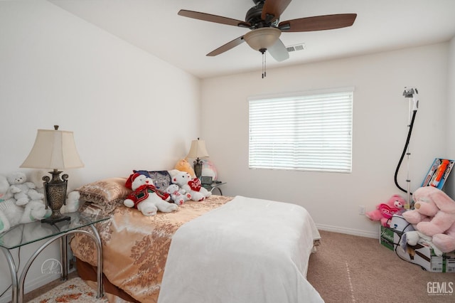 bedroom featuring ceiling fan and light carpet