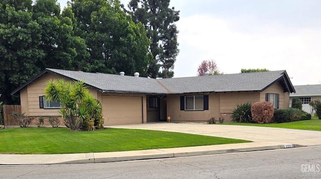 ranch-style home featuring a garage, a front lawn, concrete driveway, and brick siding