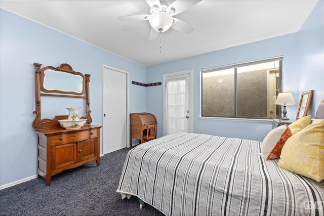 bedroom with dark carpet and ceiling fan