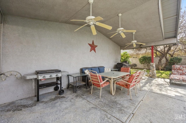 view of patio with ceiling fan and grilling area