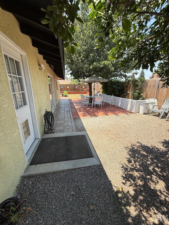 2404 Belvedere Ave, Bakersfield, CA 93304 - fenced backyard with a patio area and outdoor dining space