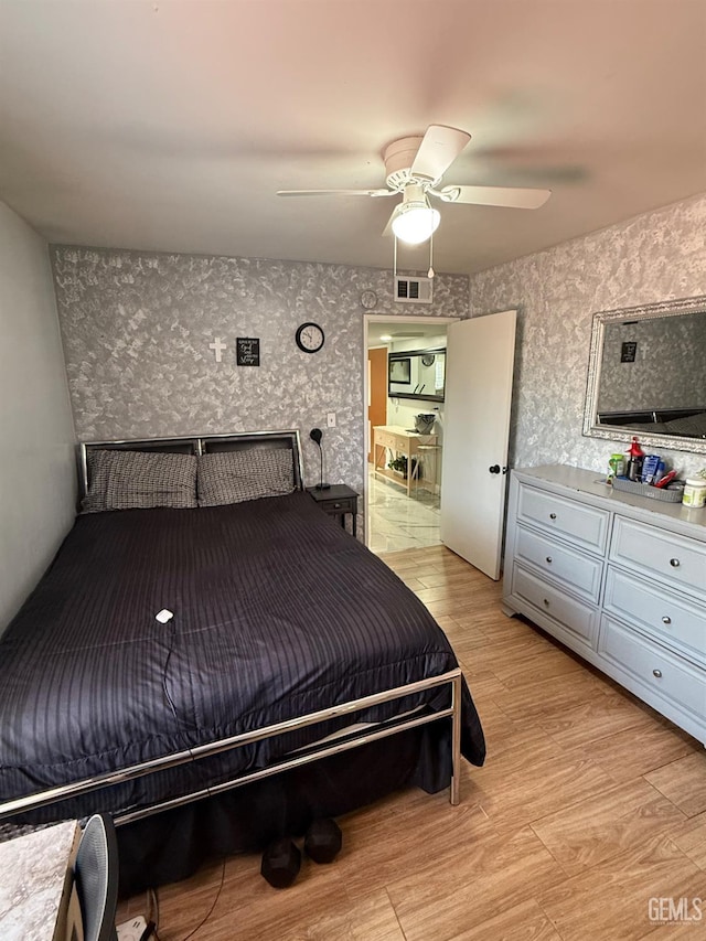 2404 Belvedere Ave, Bakersfield, CA 93304 - bedroom featuring light wood finished floors, ceiling fan, and wallpapered walls