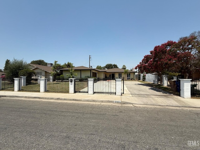 2404 Belvedere Ave, Bakersfield, CA 93304 - view of front of property with a fenced front yard, driveway, and a gate
