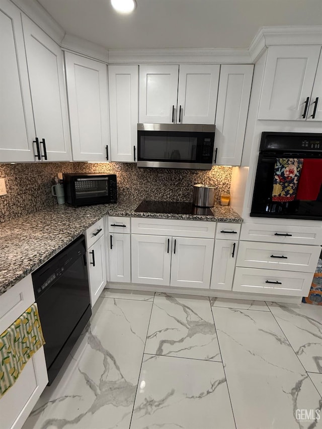 2404 Belvedere Ave, Bakersfield, CA 93304 - kitchen with black appliances, white cabinetry, dark stone countertops, light marble finish flooring, and decorative backsplash