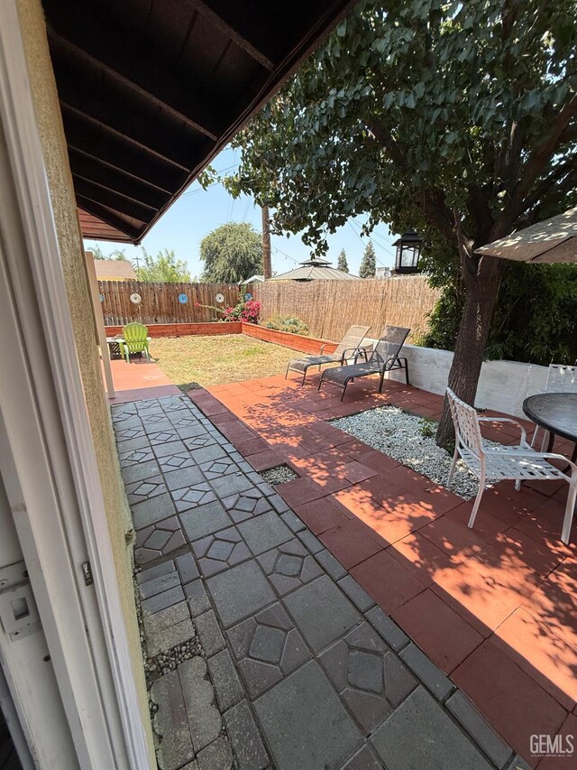 2404 Belvedere Ave, Bakersfield, CA 93304 - fenced backyard featuring a patio area