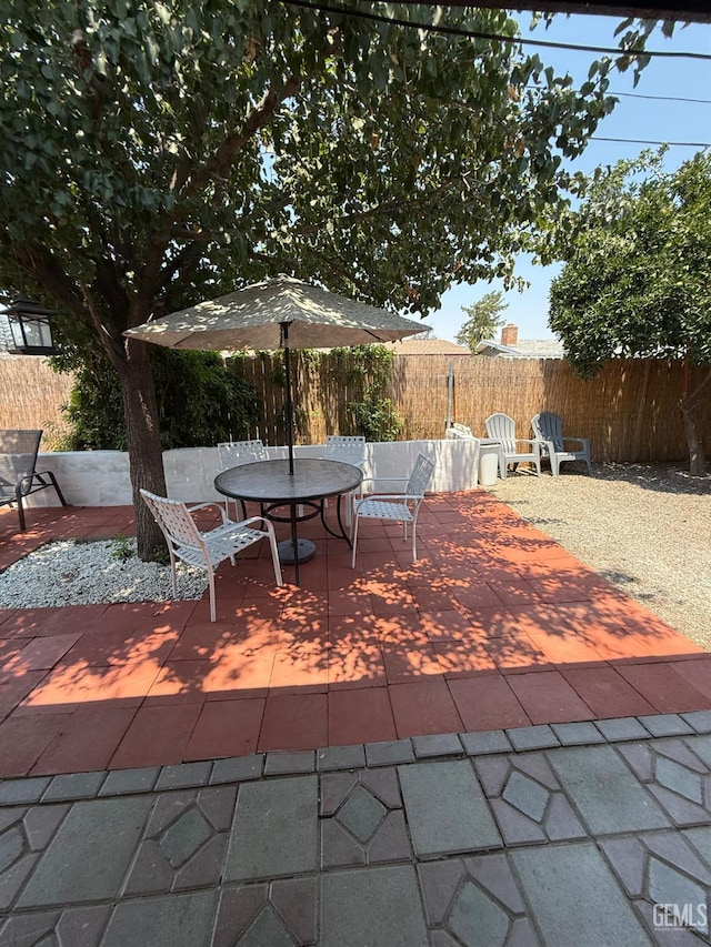 2404 Belvedere Ave, Bakersfield, CA 93304 - fenced backyard featuring a patio area and outdoor dining space