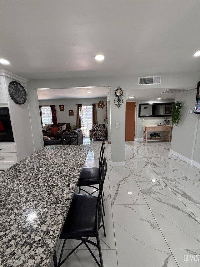 2404 Belvedere Ave, Bakersfield, CA 93304 - dining area featuring recessed lighting and light marble finish flooring