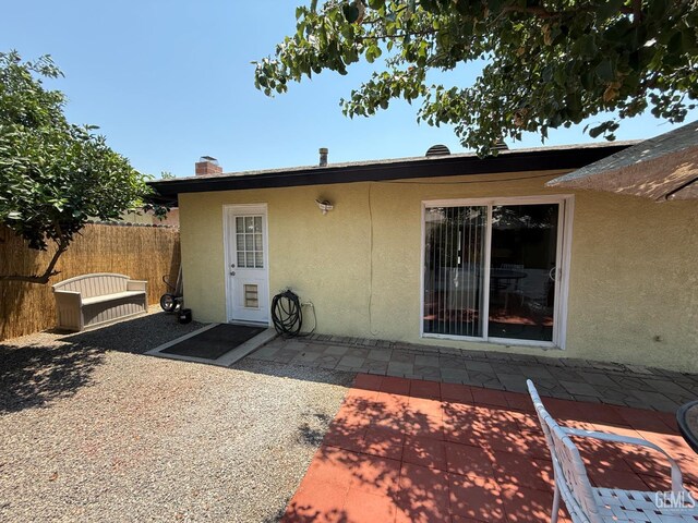 2404 Belvedere Ave, Bakersfield, CA 93304 - property entrance with stucco siding and a patio
