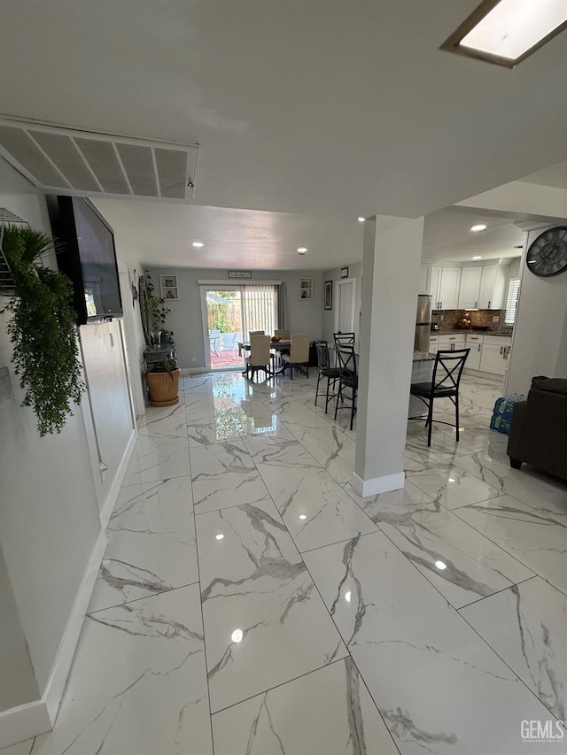 2404 Belvedere Ave, Bakersfield, CA 93304 - living area featuring light marble finish floors and recessed lighting