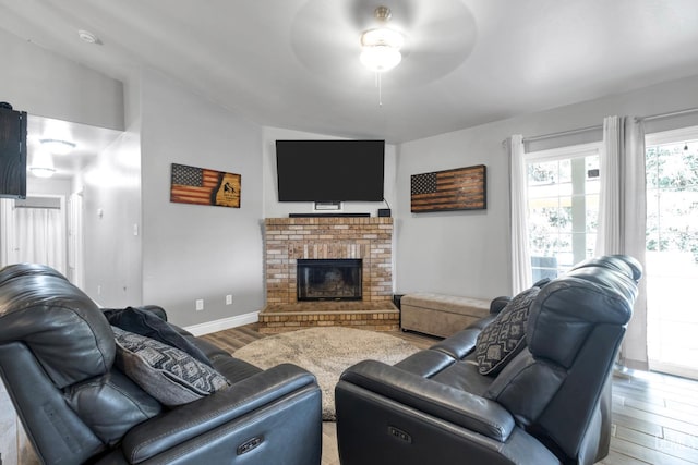 13160 Game Set Way, Bakersfield, CA 93306 - living room with wood finished floors, ceiling fan, and a brick fireplace