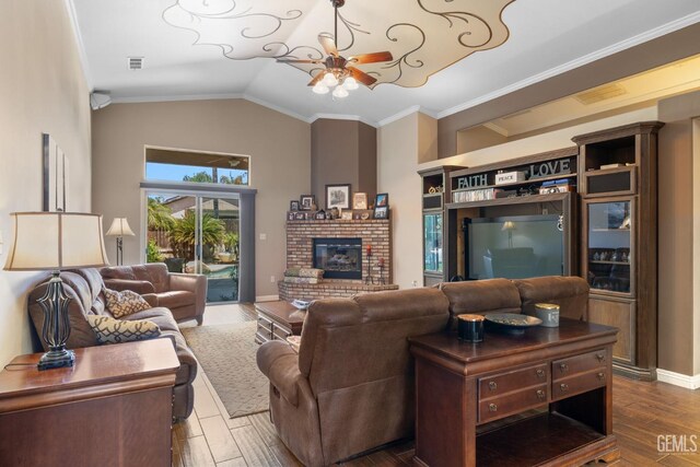 12008 Stonington St, Bakersfield, CA 93312 - living room with a ceiling fan, dark wood-style flooring, a brick fireplace, vaulted ceiling, and crown molding