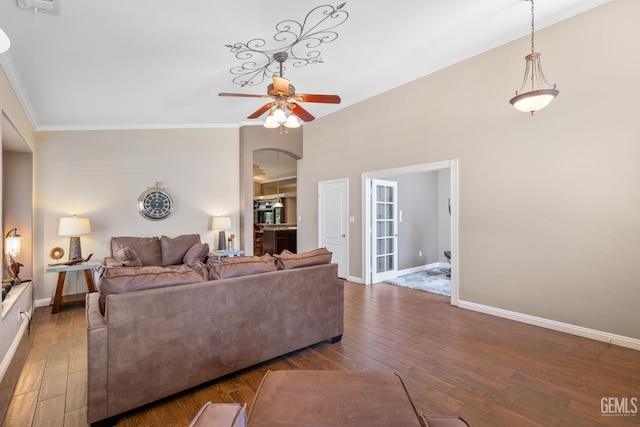 12008 Stonington St, Bakersfield, CA 93312 - living room featuring a ceiling fan, hardwood / wood-style floors, baseboards, and crown molding