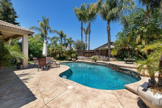 12008 Stonington St, Bakersfield, CA 93312 - view of swimming pool featuring a patio area, a fenced backyard, a ceiling fan, and outdoor dining area