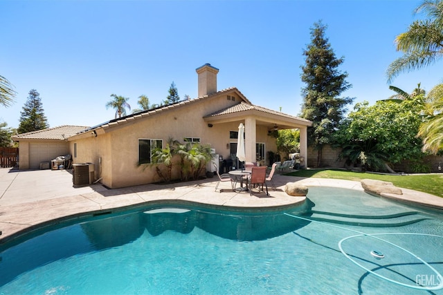 12008 Stonington St, Bakersfield, CA 93312 - outdoor pool featuring a fenced backyard, a patio, central AC unit, and ceiling fan