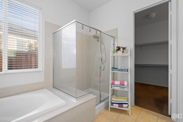 9904 Toscana Dr, Bakersfield, CA 93306 - full bath with a shower stall, tile patterned flooring, a bath, and a spacious closet