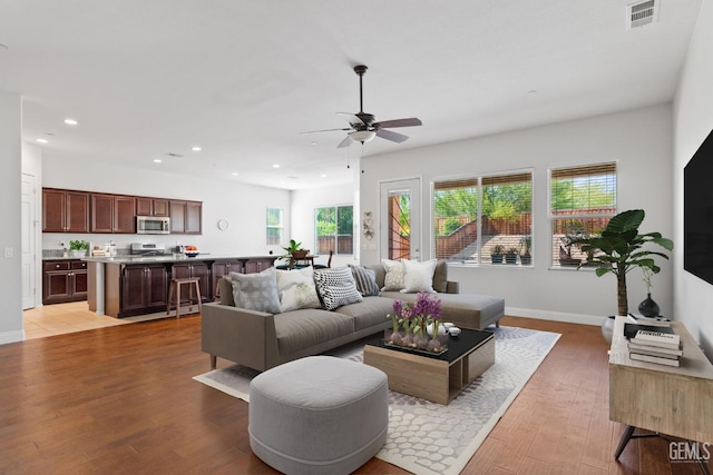 9904 Toscana Dr, Bakersfield, CA 93306 - living area featuring recessed lighting, a ceiling fan, and light wood-style floors