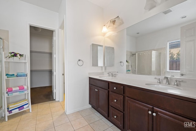 9904 Toscana Dr, Bakersfield, CA 93306 - bathroom featuring a stall shower, double vanity, and tile patterned flooring