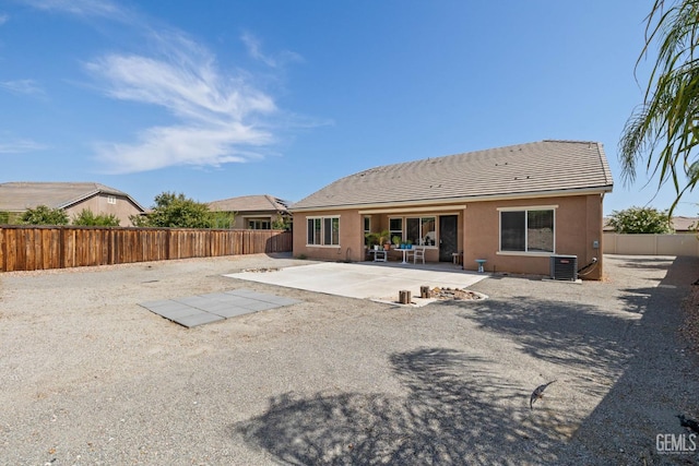 9904 Toscana Dr, Bakersfield, CA 93306 - rear view of house with a patio, a fenced backyard, a tiled roof, and stucco siding