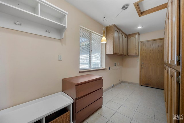 kitchen with pendant lighting and light tile patterned flooring