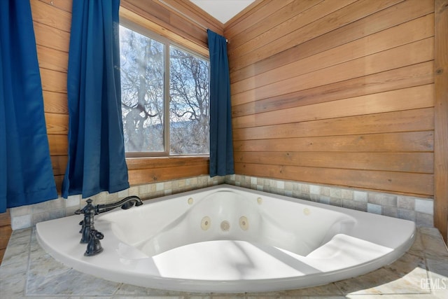 bathroom with wooden walls and tiled tub