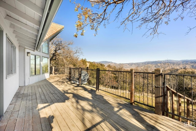 wooden terrace featuring a mountain view