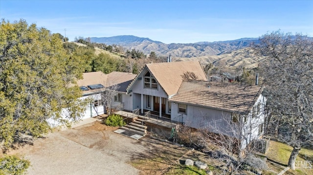 rear view of house with a mountain view