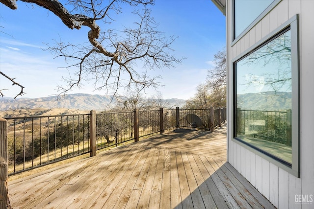 wooden terrace featuring a mountain view