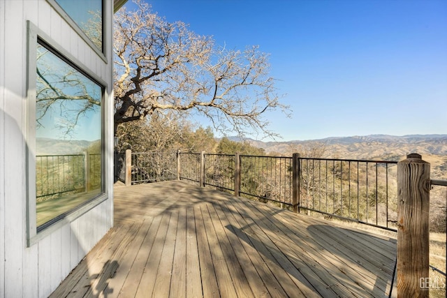 wooden terrace featuring a mountain view