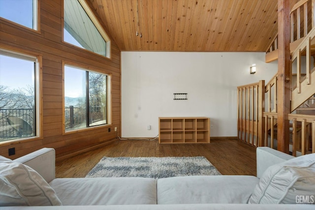 living room with hardwood / wood-style floors, wood ceiling, wooden walls, and high vaulted ceiling