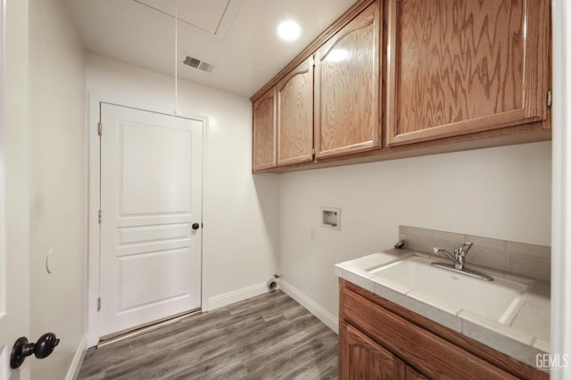 14211 Cedar Creek Ave, Bakersfield, CA 93314 - washroom with hookup for a washing machine, wood finished floors, cabinet space, and attic access