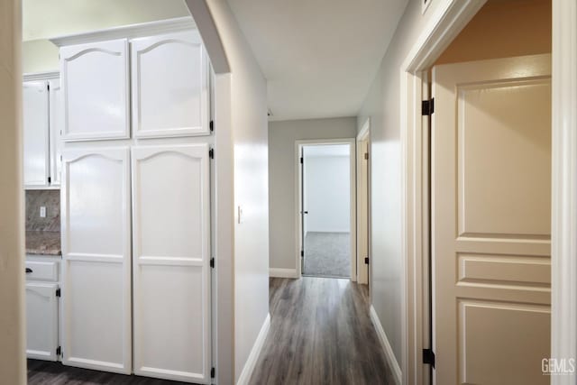 14211 Cedar Creek Ave, Bakersfield, CA 93314 - corridor featuring dark wood finished floors and baseboards