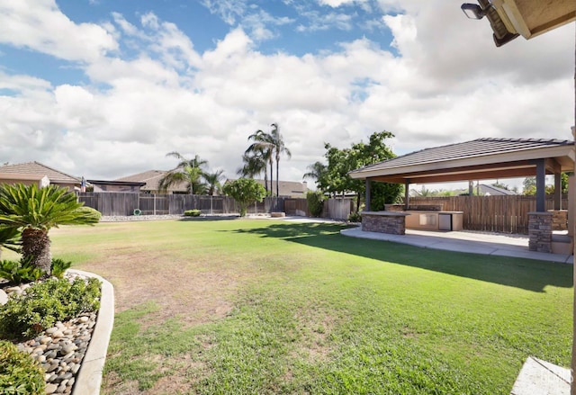 14211 Cedar Creek Ave, Bakersfield, CA 93314 - fenced backyard featuring a gazebo, a patio, and an outdoor kitchen