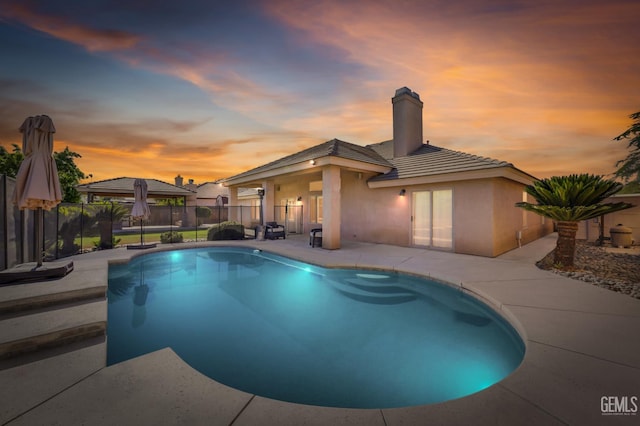 14211 Cedar Creek Ave, Bakersfield, CA 93314 - pool at dusk featuring a patio and a gazebo